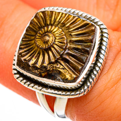 Sterling silver ring with gold pyrite spiral cabochon, raised bezel on finger