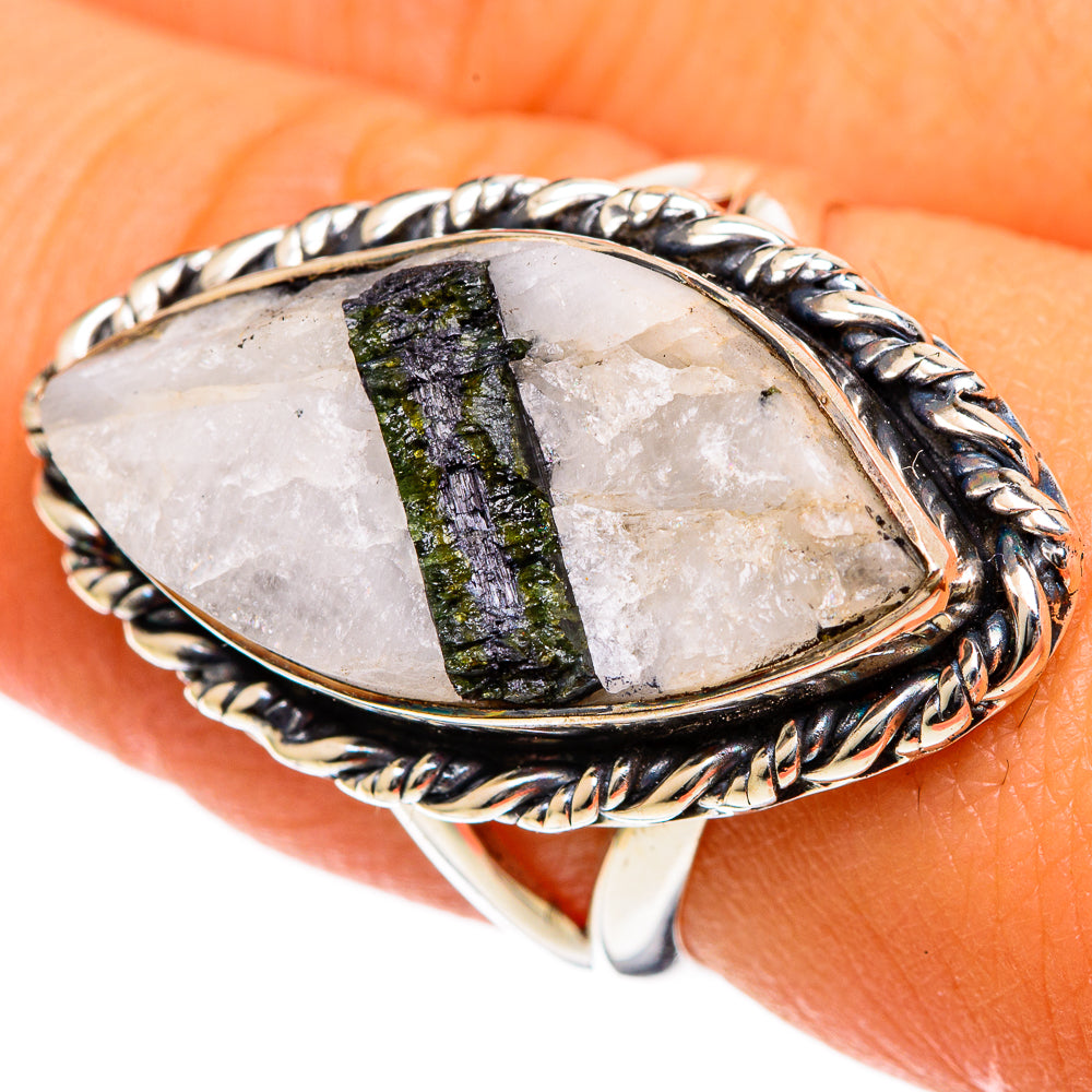 Oval quartz-and-tourmaline ring in silver with twisted rope border bezel.
