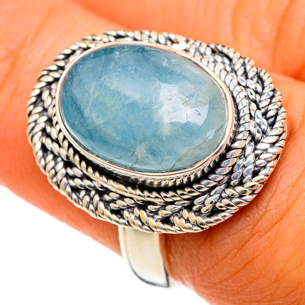 Aquamarine oval ring in silver with rope-texture bezel, stone set in oval frame