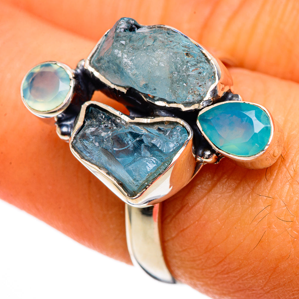 Sterling silver ring featuring rough teal-blue chalcedony stones and aqua round accents