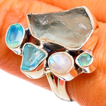 Sterling silver gemstone ring with moonstone cabochon, teal stones, and rough aquamarine