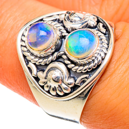 Sterling silver opal ring with three blue-green oval stones and ornate filigree setting