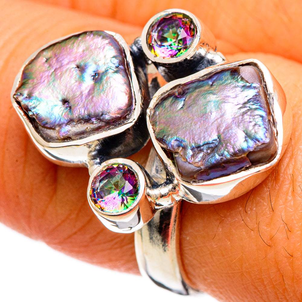 Sterling silver ring with three iridescent mother-of-pearl stones and round mystic topaz accents