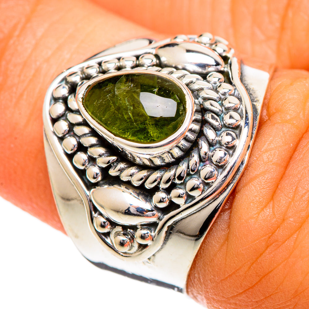 Sterling silver ring with oval green tourmaline and beaded twisted metal bezel