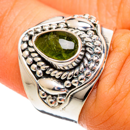 Sterling silver ring with oval green tourmaline and beaded twisted metal bezel