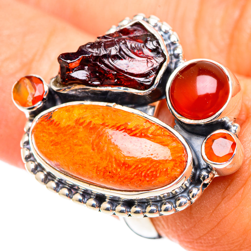 Sterling silver ring with oval orange stone, red round cabochon, and dark red marbled inlay