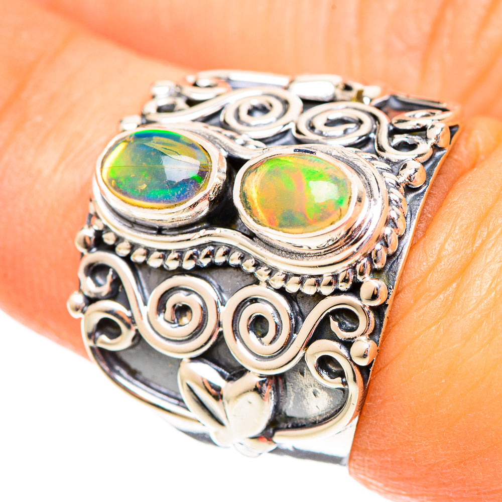 925 sterling silver opal ring with two oval stones and filigree scroll setting