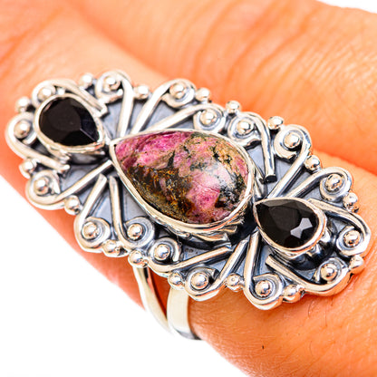 Sterling silver ring close-up with rhodonite oval center and two black onyx accents