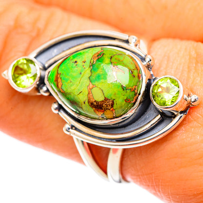 Green oval turquoise-style stone with peridot accents, sterling silver ring