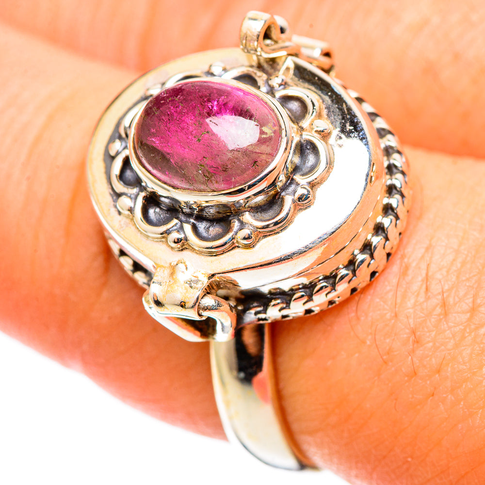 Sterling silver ring with pink oval gemstone, decorative side band and prong settings