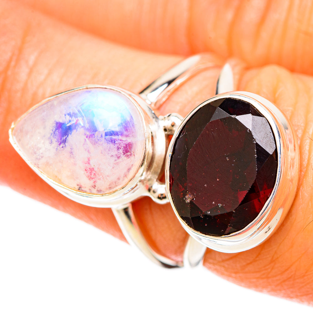 Sterling silver ring with oval rainbow moonstone and faceted dark red garnet