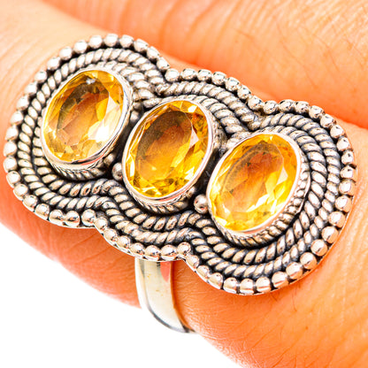 Large citrine ring: 925 sterling silver with three faceted oval yellow stones, beaded setting