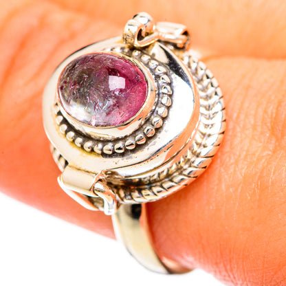 Pink tourmaline oval ring with engraved bezel and twisted-look side details