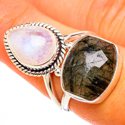 Stacked teardrop gemstone rings with opal-like and green quartz stones in silver settings