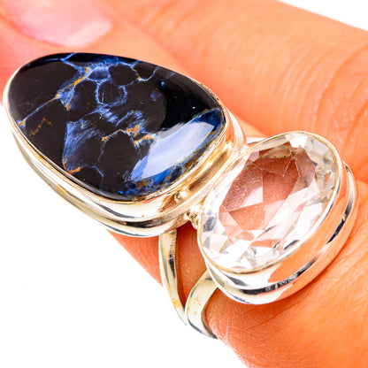 Gold-tone ring with blue pietersite oval center and clear oval quartz bezel