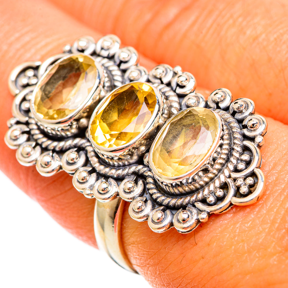 Three-stone oval citrine ring with faceted yellow gems and beaded sterling silver