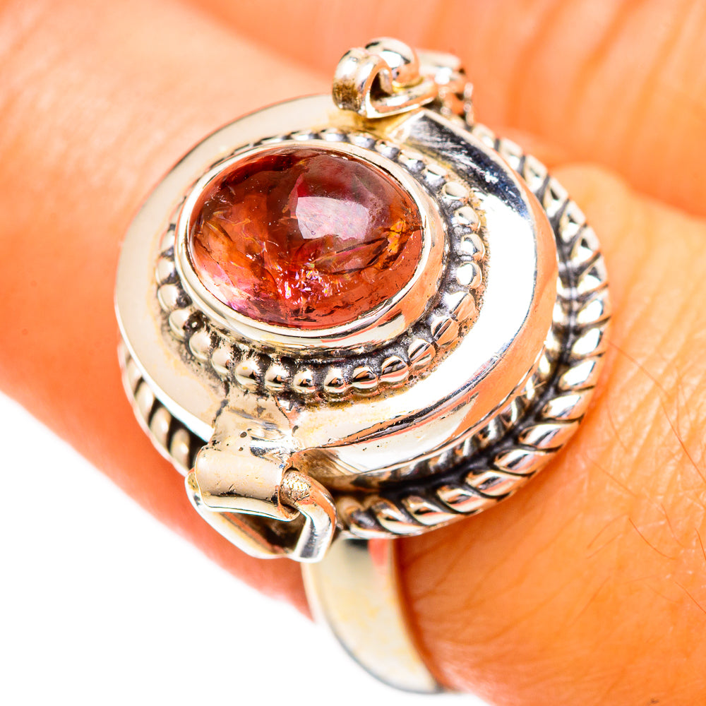 925 sterling silver ring with oval pink-orange gemstone, braided halo and split shank