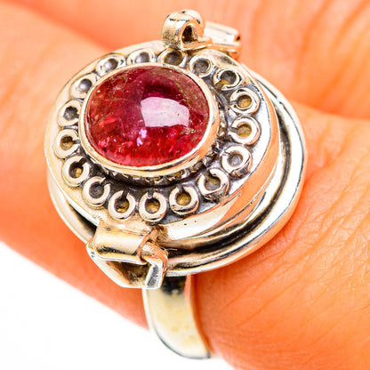Sterling silver tourmaline ring with round pink-red center stone and detailed filigree setting