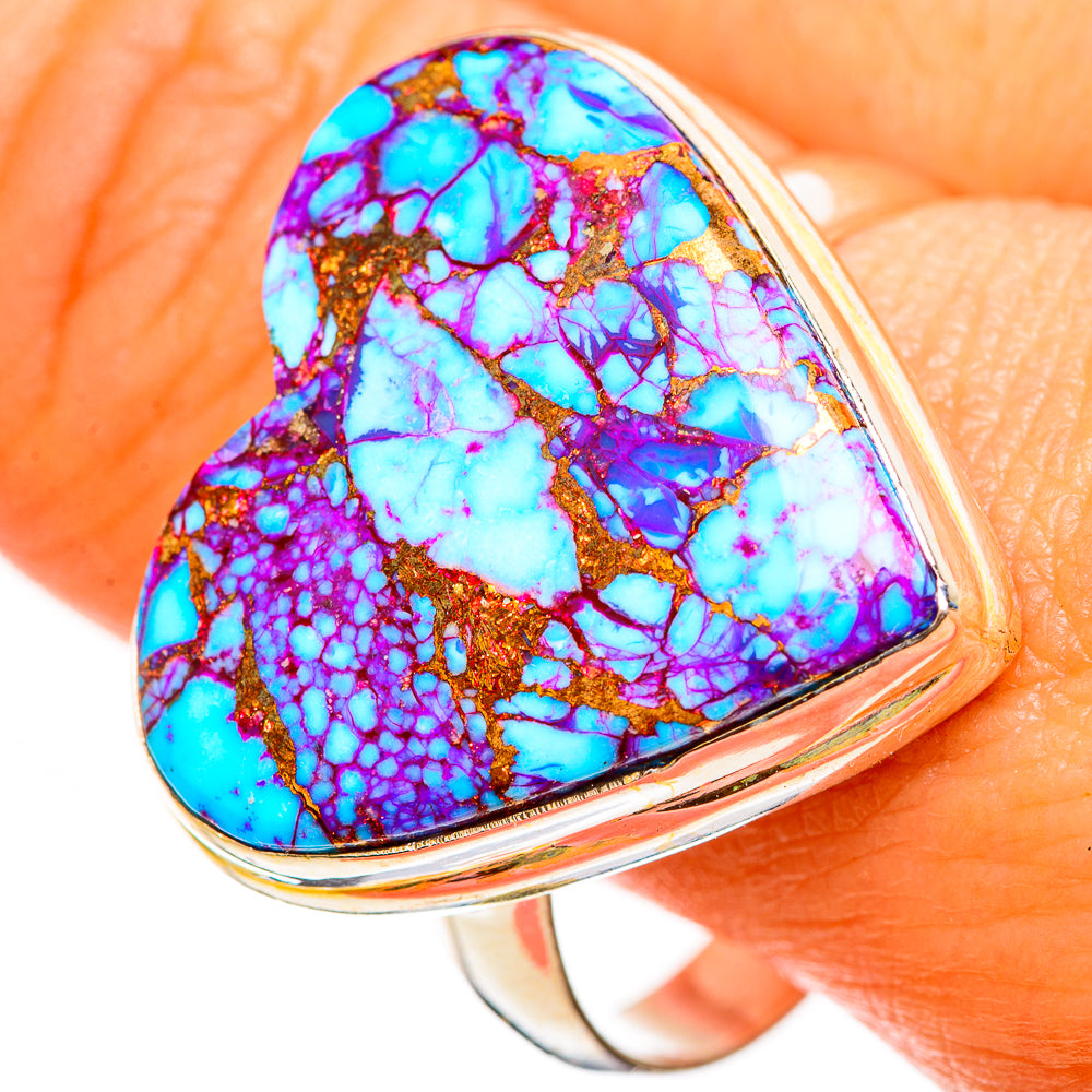 Heart-shaped turquoise ring close-up, blue and purple marbled stone on silver band