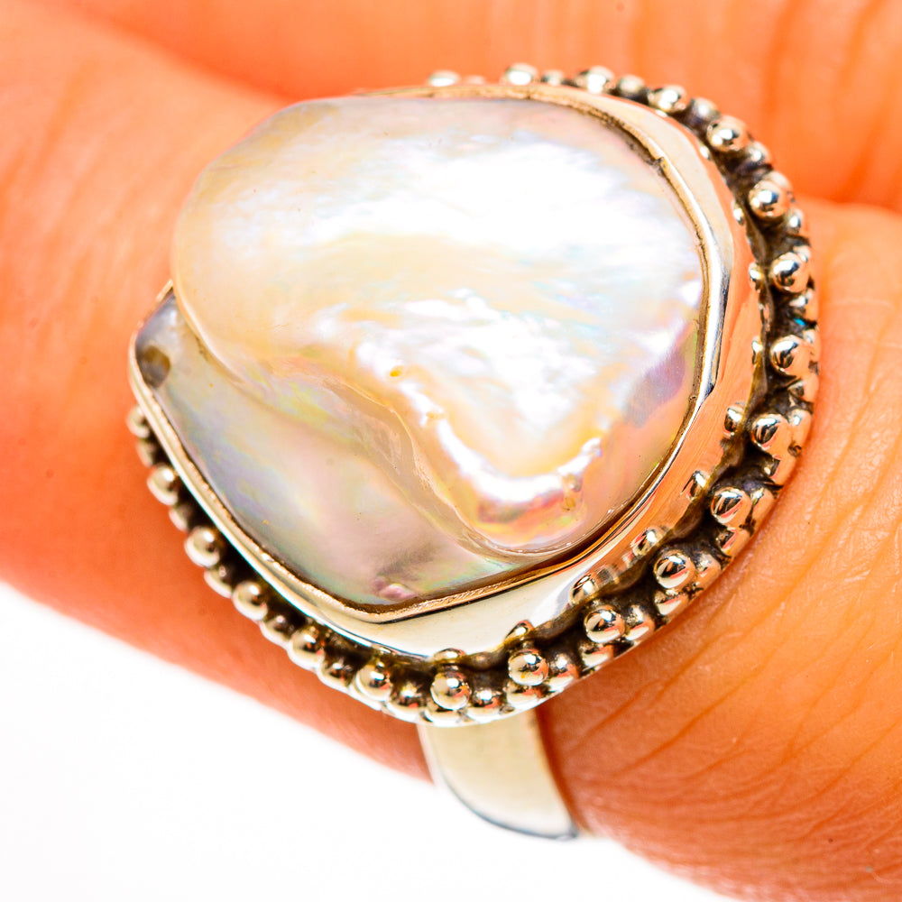 Sterling silver ring with oval mother-of-pearl and raised beaded border on band