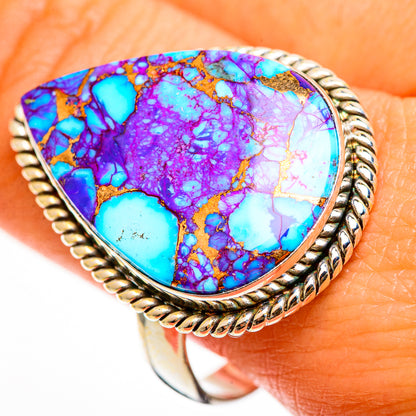 Teardrop turquoise inlay ring close-up, purple and blue stone with braided gold-tone edge