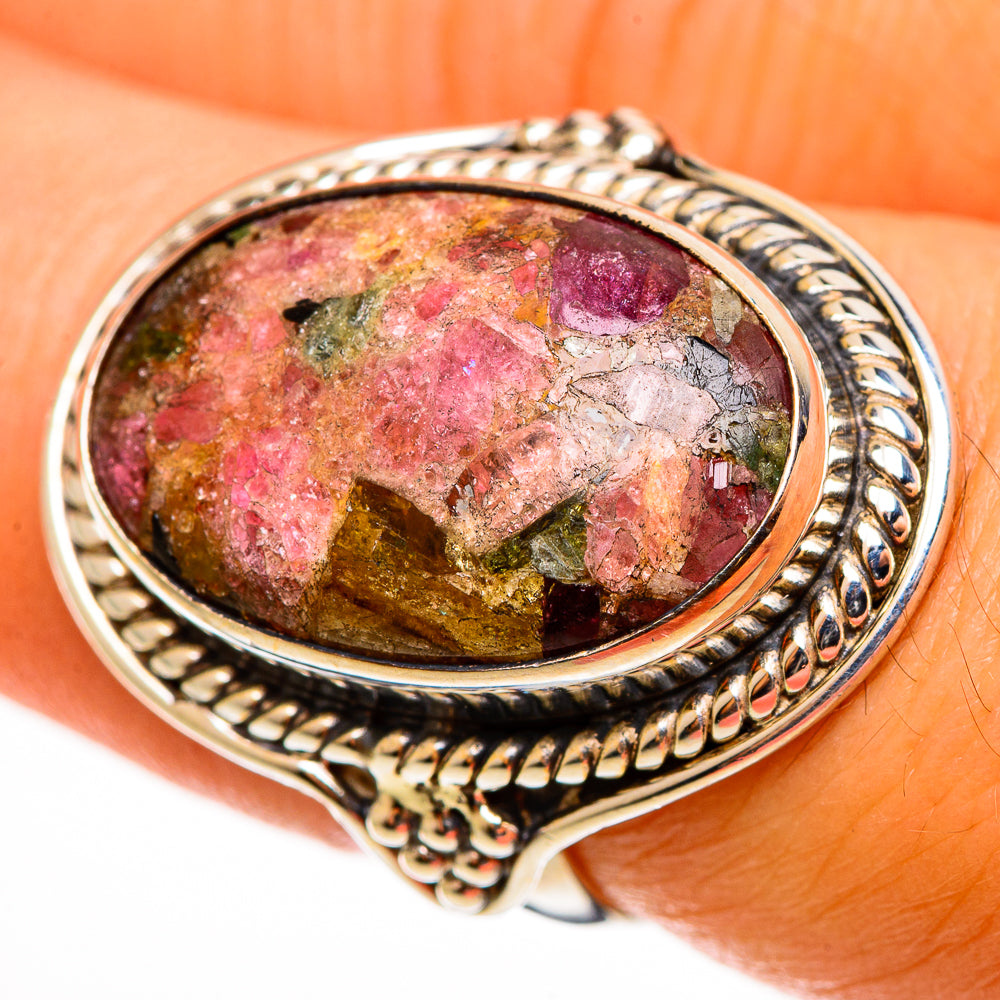 Sterling silver oval tourmaline ring close-up, bright pink and green speckled stone in bezel