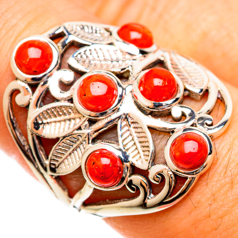Close-up: silver ring with red coral cabochons and leaf filigree, size 8