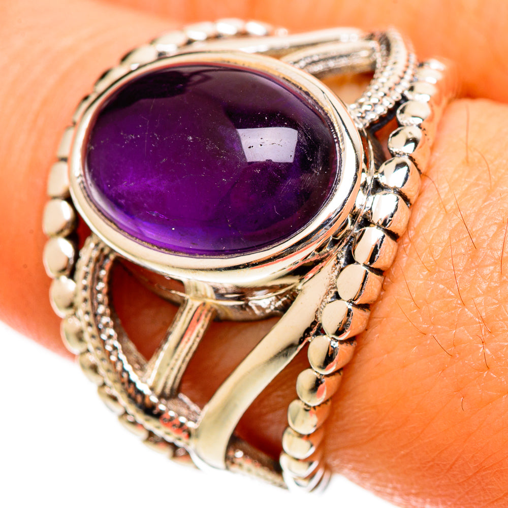 Amethyst oval gemstone ring with silver-tone openwork band and beaded side details