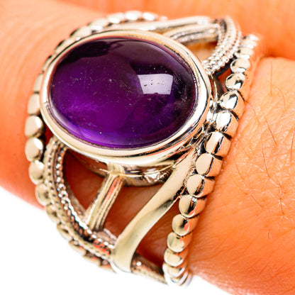 Amethyst oval gemstone ring with silver-tone openwork band and beaded side details