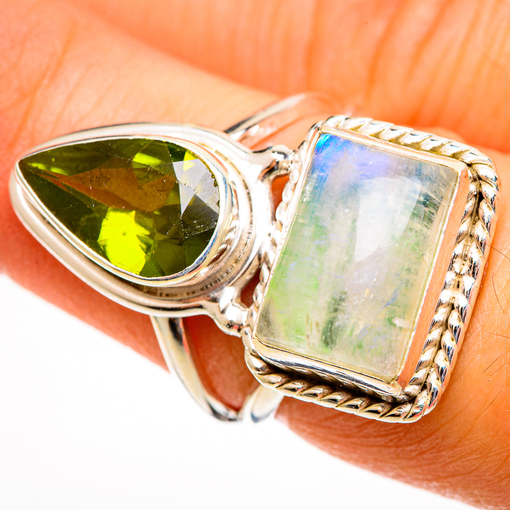 Sterling silver ring close-up: oval green gem and rectangular stone with braided bezel