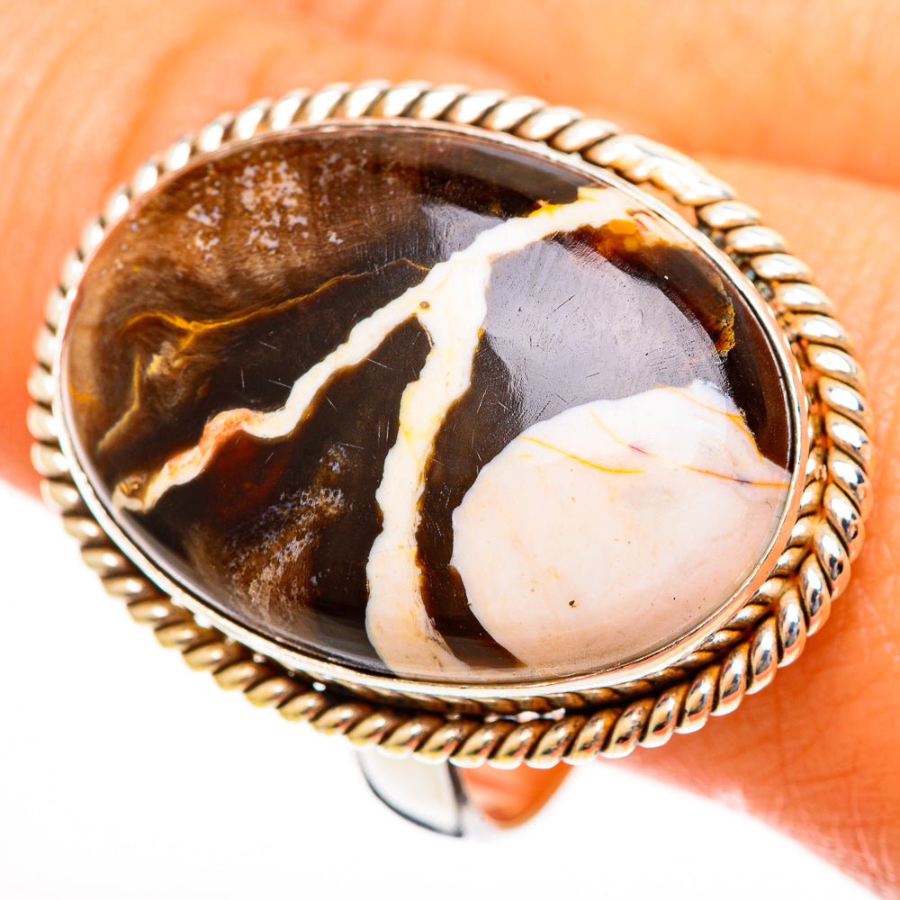 Large oval jasper ring on finger, white/orange marbled cabochon in rope 925 silver setting