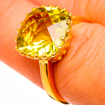 Gold plated citrine cocktail ring with faceted yellow gemstone and prong-set halo