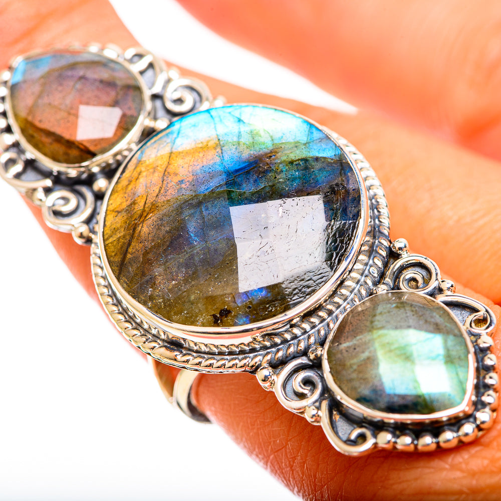 Three-stone labradorite ring with oval settings; bright blue and gold iridescence on silver