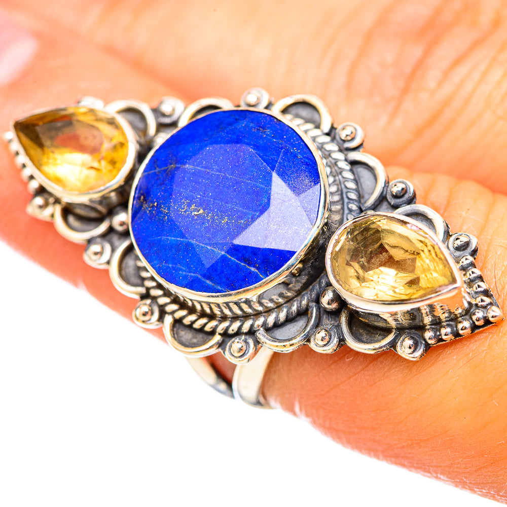 Sterling silver ring with oval lapis lazuli center and citrine side stones
