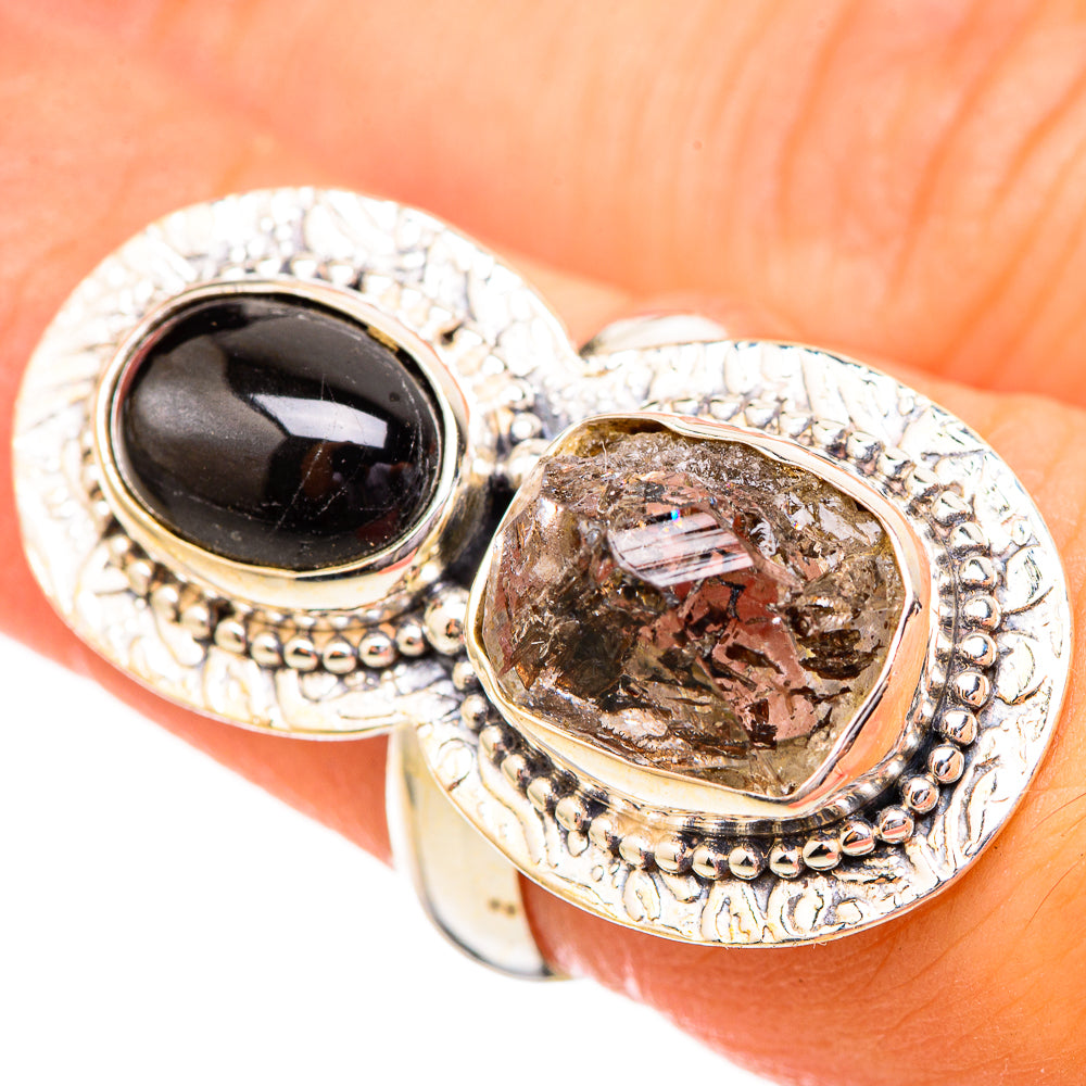 Sterling silver ring with black oval onyx and clear, faceted crystal in oval setting