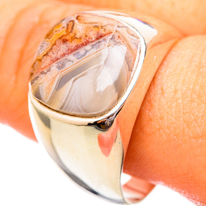 Silver-tone band with oval agate gemstone set in a bezel, side profile on skin