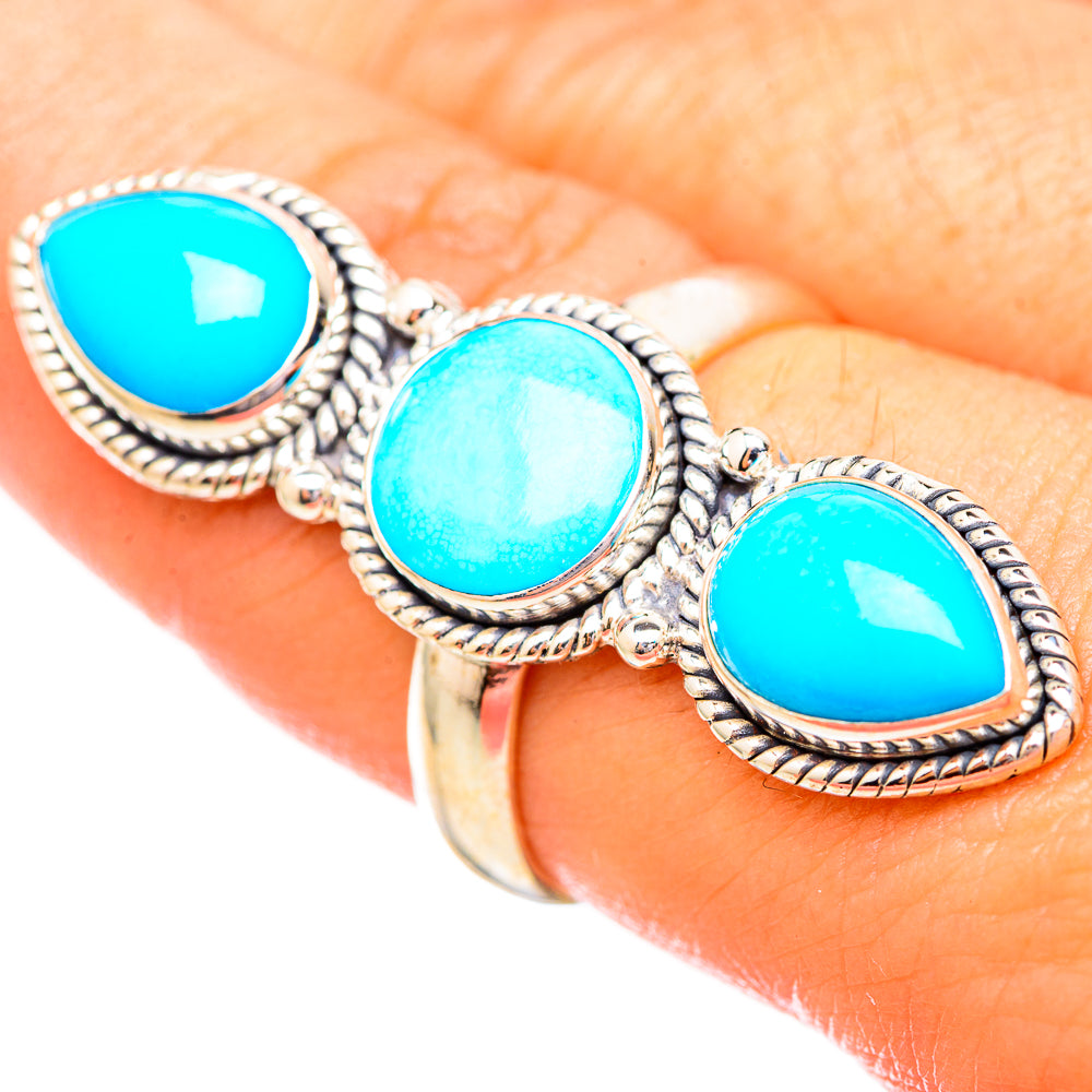 Turquoise oval gemstone ring with three stones and rope-edged sterling silver settings