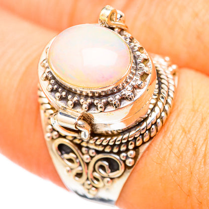 Silver-tone opal cabochon ring with round white opal and ornate beaded filigree band