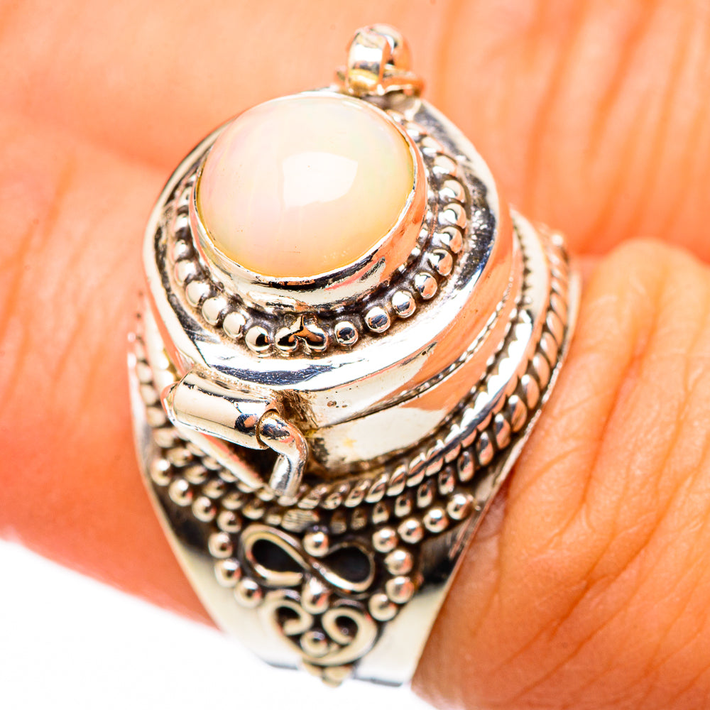 Oval opal centerpiece on 925 sterling silver filigree ring with decorative border