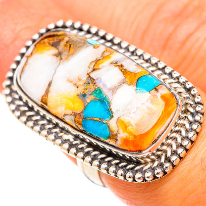 Oval turquoise composite ring with blue and orange inlay, silver beaded bezel