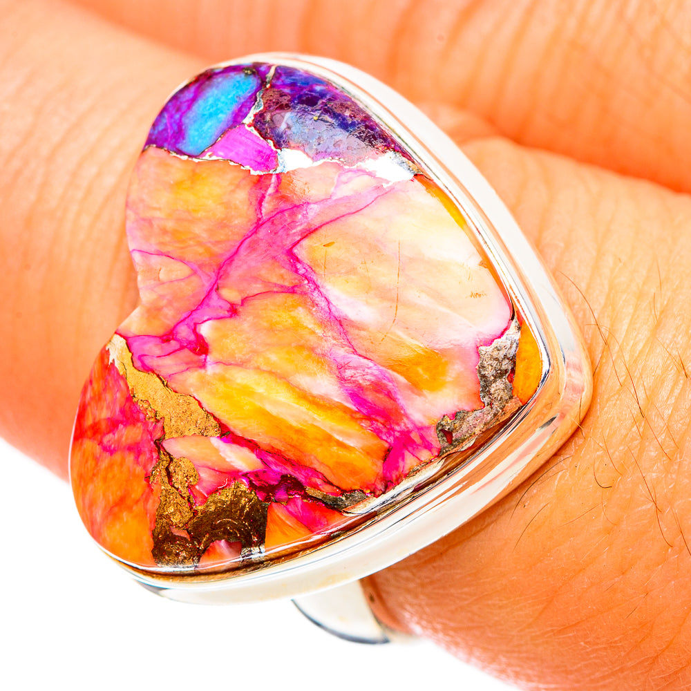 Heart-shaped multicolor stone sterling silver ring, close-up on finger