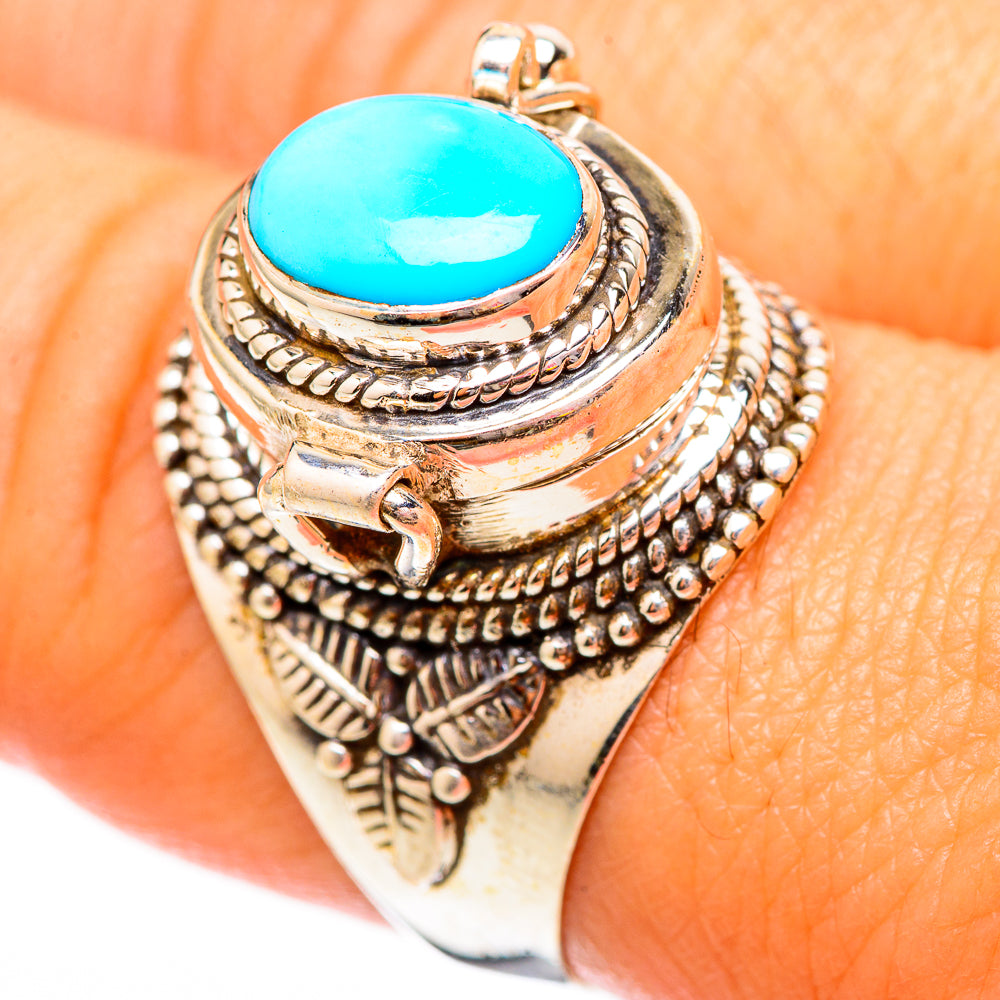 Turquoise oval cabochon ring with ornate silver filigree setting