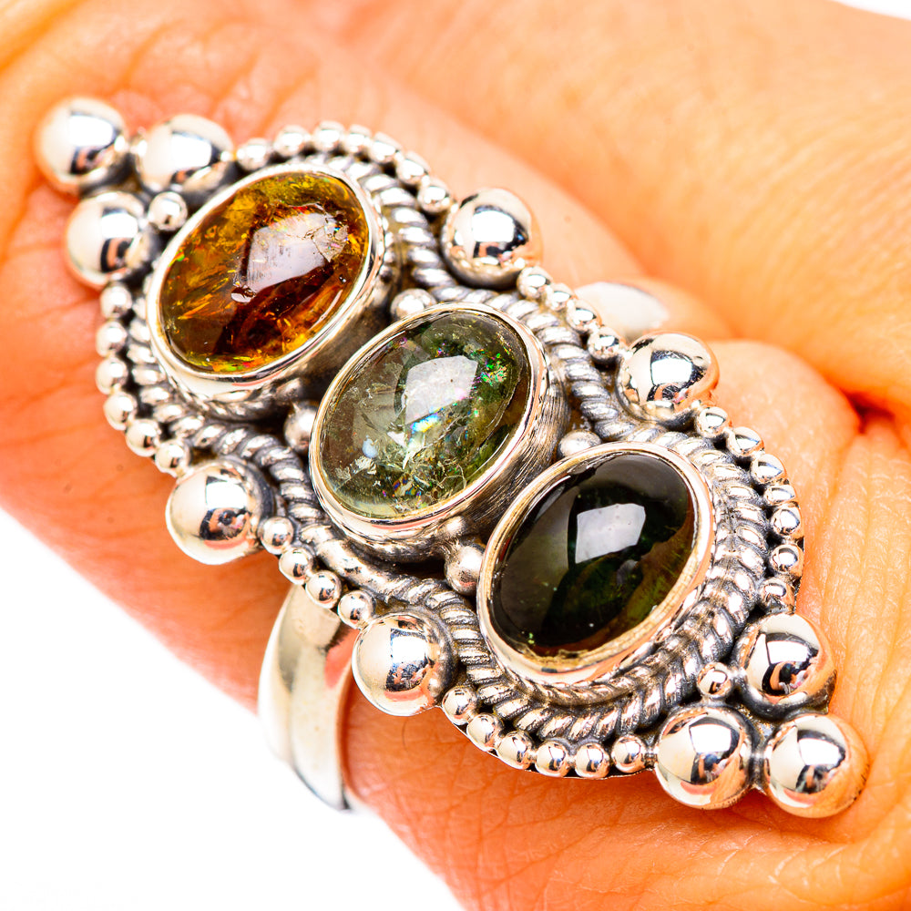 925 sterling silver three-stone tourmaline ring with amber, light green, and dark green cabochons.