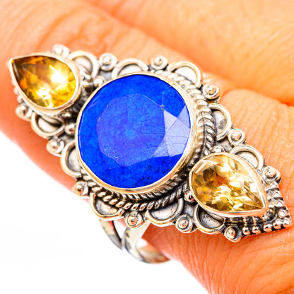 Sterling silver ring with oval lapis lazuli center and two citrine teardrop side stones
