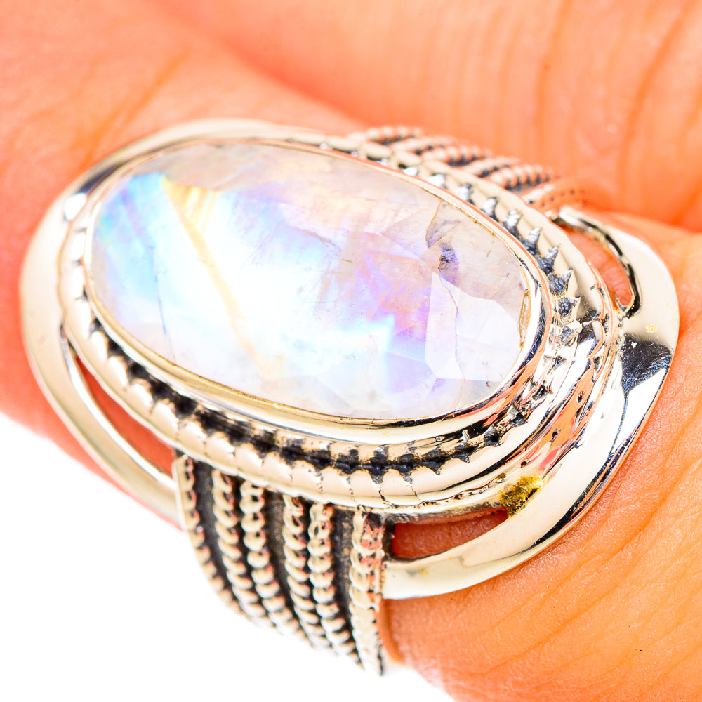 925 sterling silver ring close-up: oval moonstone with iridescent rainbow sheen, textured prongs