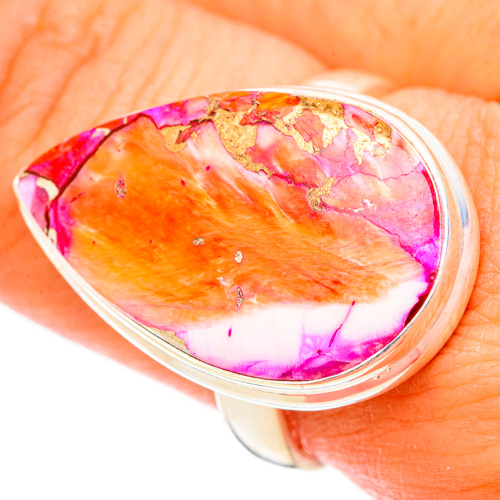 Silver-tone oval bezel ring with orange, pink, and purple cabochon