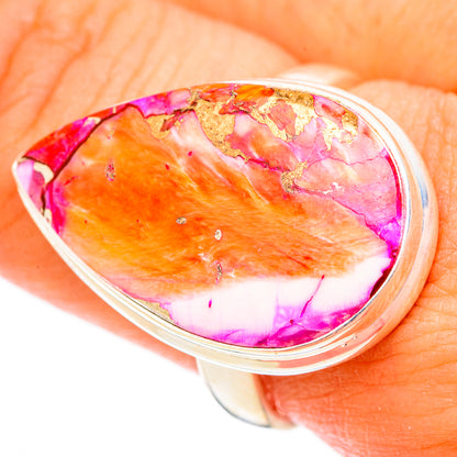 Silver-tone oval bezel ring with orange, pink, and purple cabochon