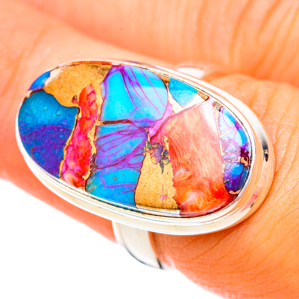 Sterling silver oval bezel ring with blue, pink, orange, and green gemstone cabochon
