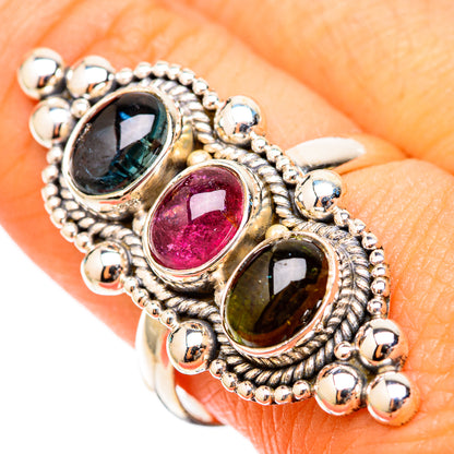 Tourmaline ring close-up: oval blue, pink, and green stones with beaded silver-tone bezel