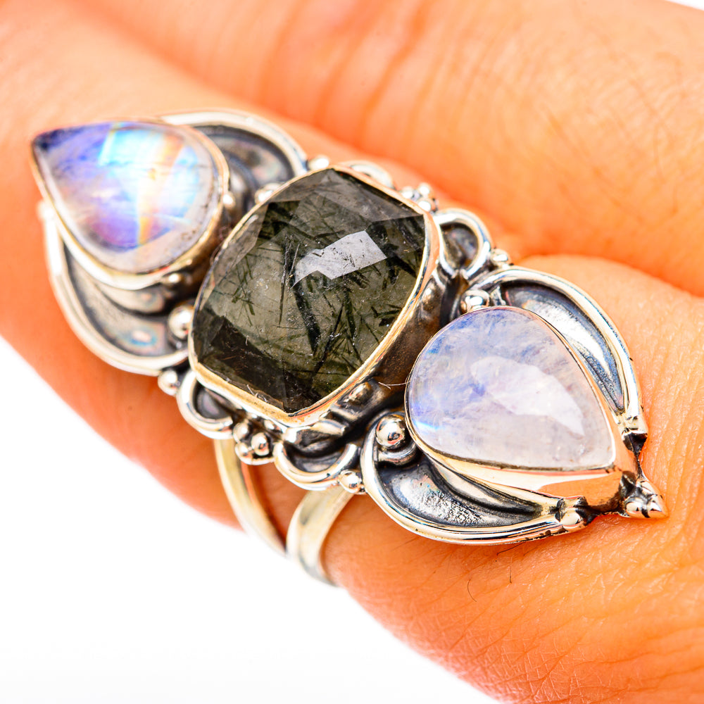 Sterling silver ring with dark green quartz centerpiece and two pear moonstones